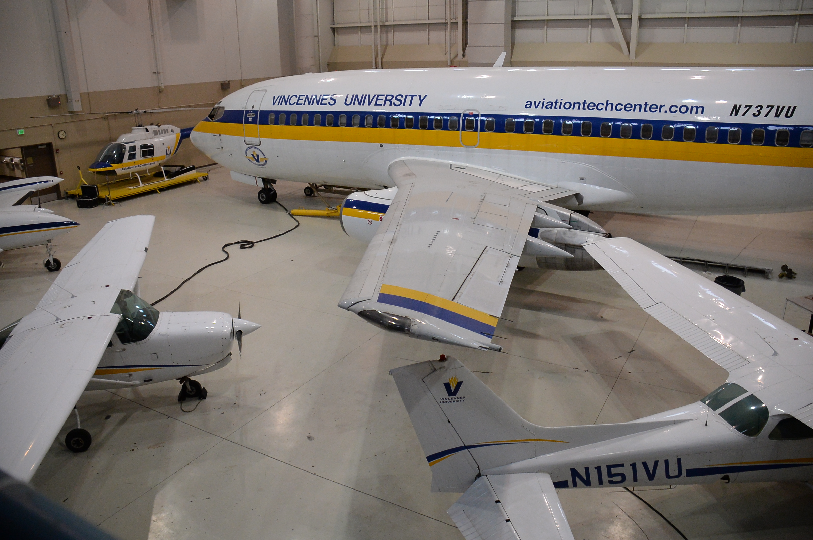 Multiple VU aircraft in a VU Aviation Technology Center hangar.